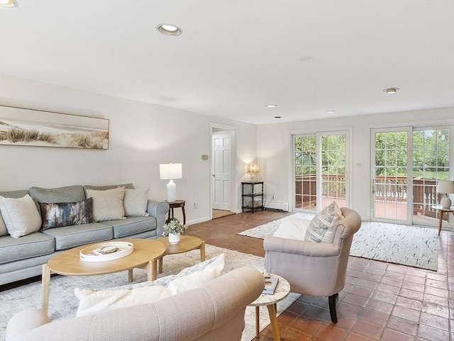 living room featuring recessed lighting and baseboards