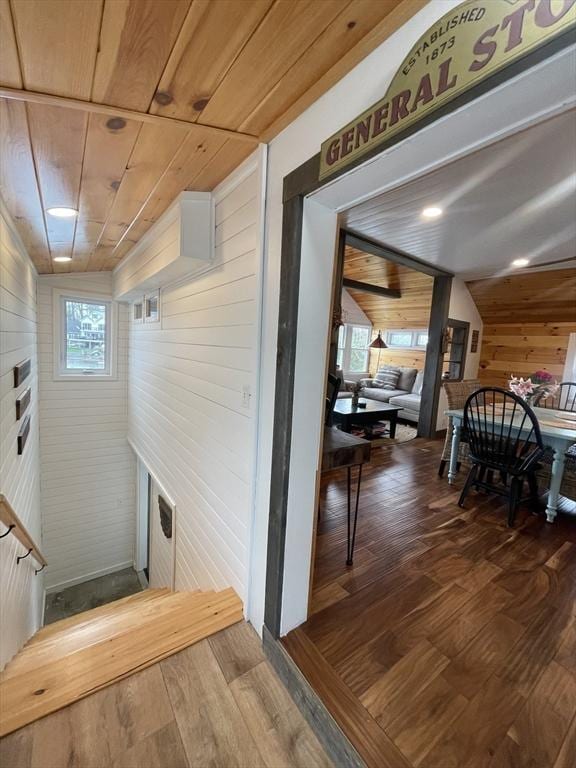 134 Kibbe Rd, Otis, MA 01029 - hallway featuring wooden walls, wooden ceiling, and dark wood-type flooring