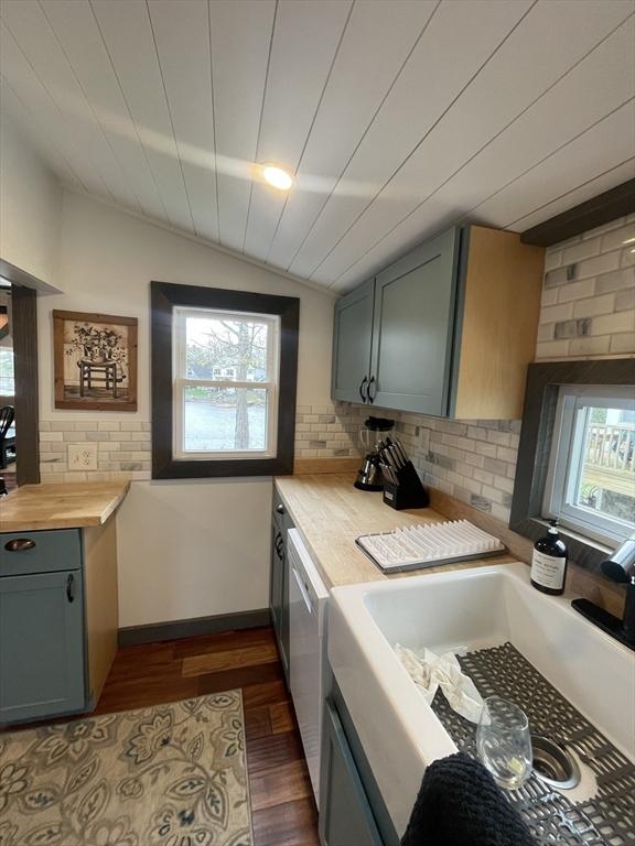 134 Kibbe Rd, Otis, MA 01029 - laundry room with baseboards, dark wood-style flooring, and a sink