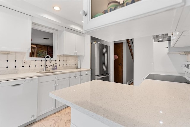47 Churchill St, Sudbury, MA 01776 - kitchen with dishwasher, freestanding refrigerator, white cabinetry, tasteful backsplash, and stove