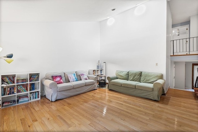 47 Churchill St, Sudbury, MA 01776 - living area with high vaulted ceiling and wood finished floors