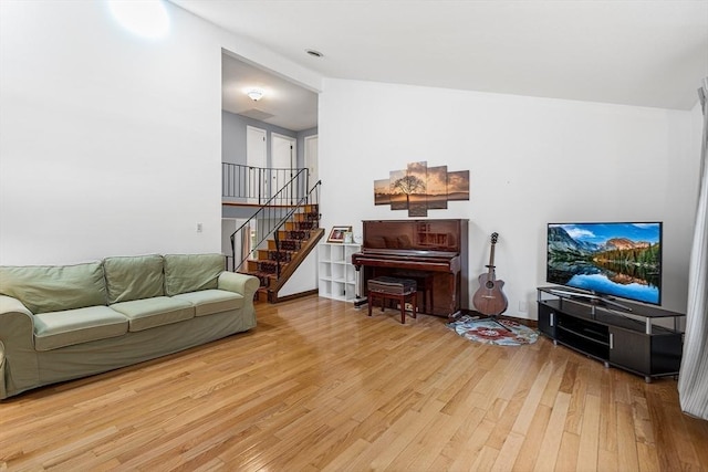 47 Churchill St, Sudbury, MA 01776 - living area with light wood finished floors and stairs