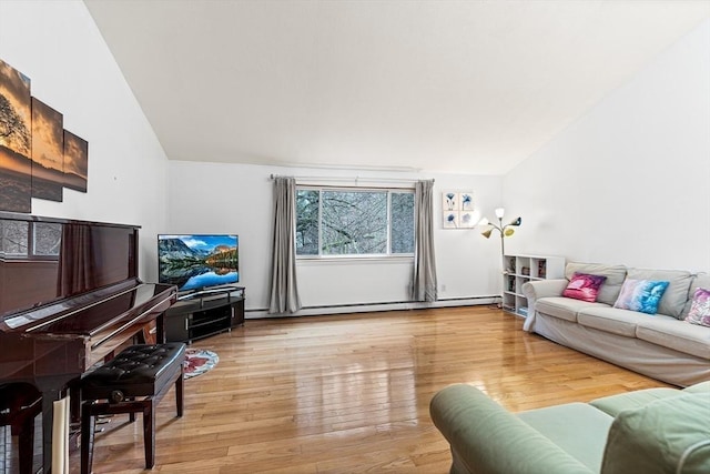 47 Churchill St, Sudbury, MA 01776 - living room featuring lofted ceiling, a baseboard radiator, and wood finished floors