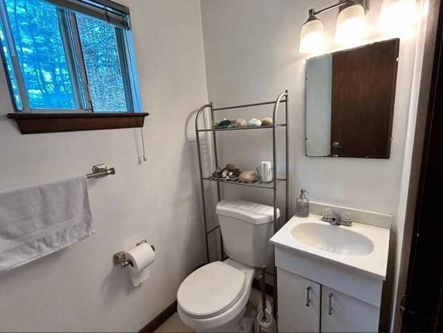 47 Churchill St, Sudbury, MA 01776 - half bathroom featuring toilet and vanity