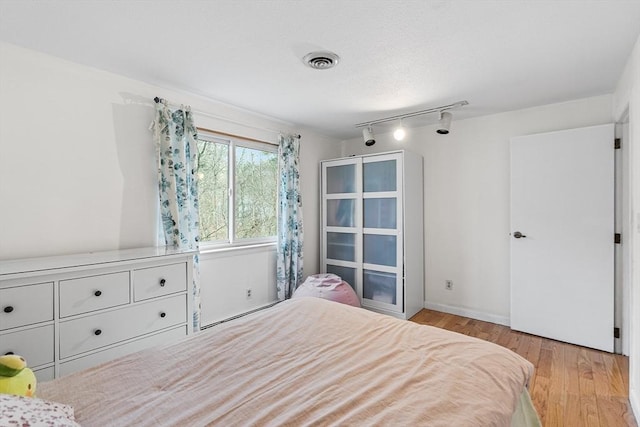 47 Churchill St, Sudbury, MA 01776 - bedroom featuring wood finished floors and rail lighting