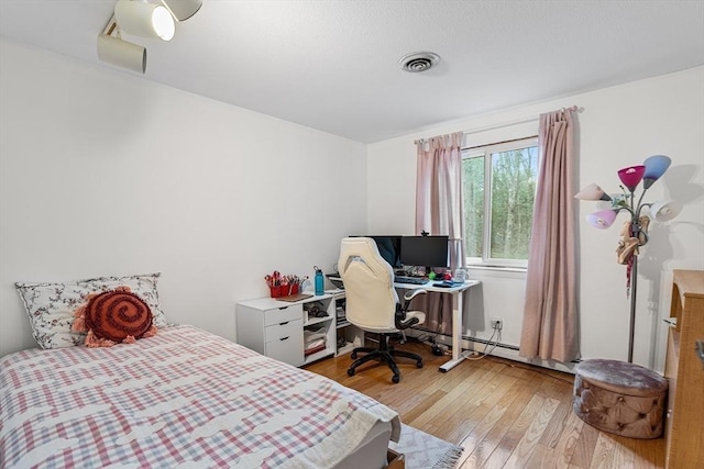 47 Churchill St, Sudbury, MA 01776 - bedroom with light wood finished floors and a desk