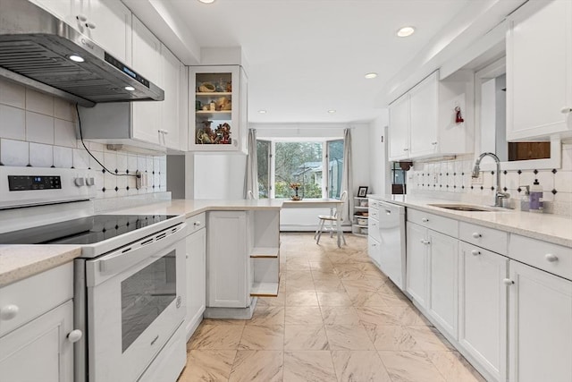 47 Churchill St, Sudbury, MA 01776 - kitchen with white appliances, extractor fan, white cabinetry, tasteful backsplash, and recessed lighting