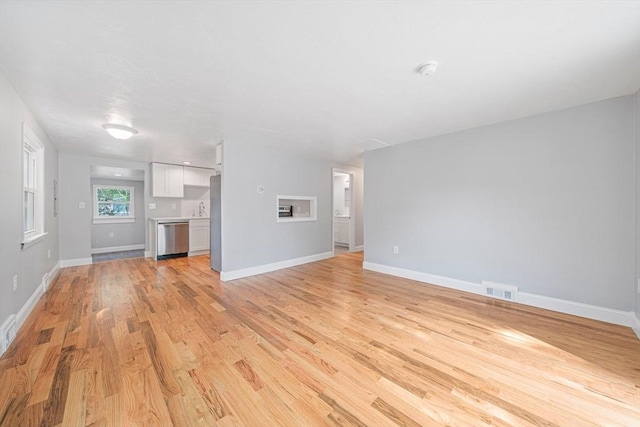 13 Hickory Rd, Halifax, MA 02338 - unfurnished living room with light wood-type flooring and baseboards