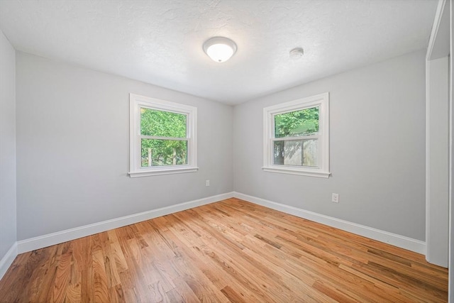 13 Hickory Rd, Halifax, MA 02338 - spare room featuring light wood-type flooring and a smoke detector