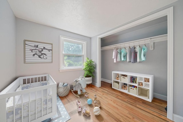 13 Hickory Rd, Halifax, MA 02338 - bedroom with a crib and wood finished floors