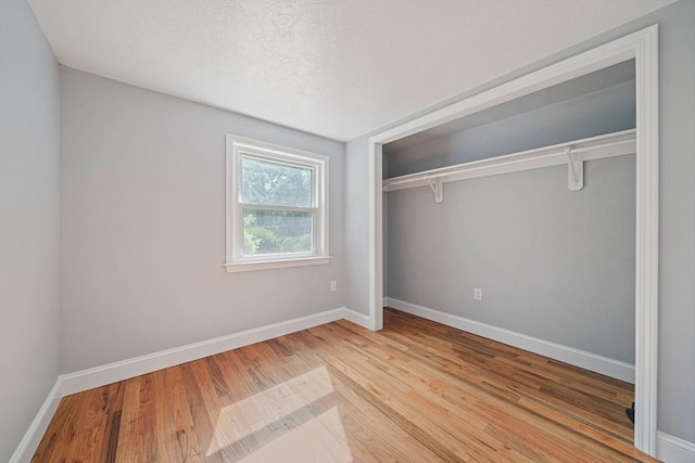 13 Hickory Rd, Halifax, MA 02338 - unfurnished bedroom with a closet and wood finished floors