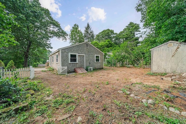 13 Hickory Rd, Halifax, MA 02338 - back of house featuring a shed