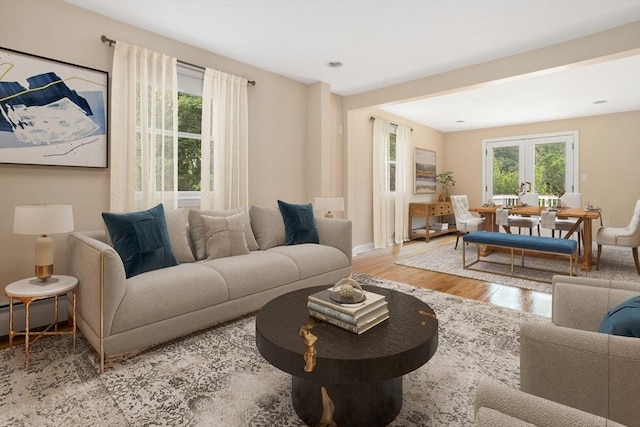 35 Faulkner Hill Rd, Acton, MA 01720 - living area with wood finished floors, french doors, and baseboard heating
