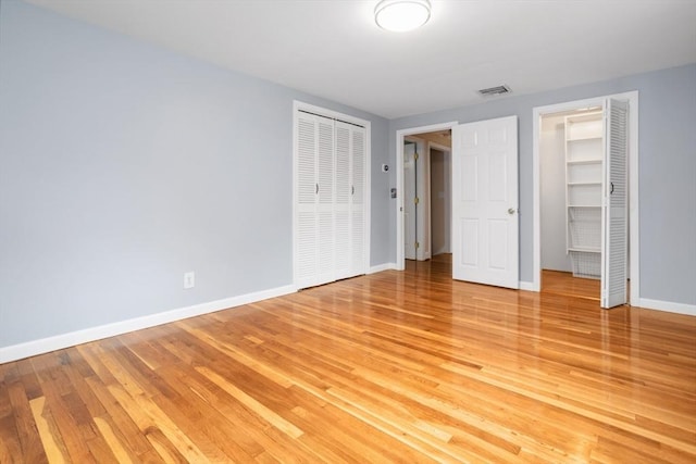35 Faulkner Hill Rd, Acton, MA 01720 - unfurnished bedroom with light wood finished floors and multiple closets