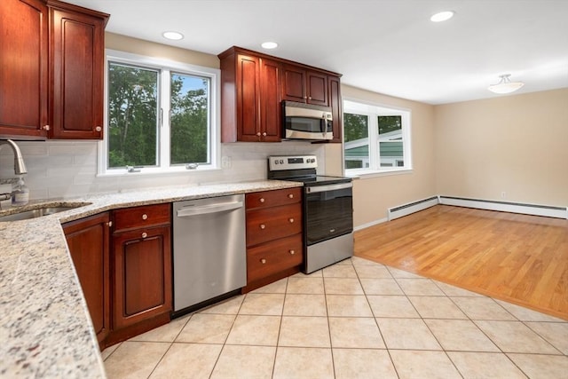 35 Faulkner Hill Rd, Acton, MA 01720 - kitchen with stainless steel appliances, decorative backsplash, healthy amount of natural light, and recessed lighting