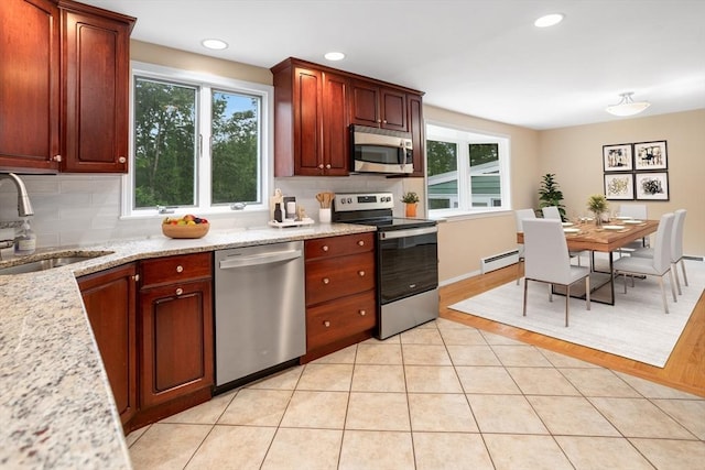 35 Faulkner Hill Rd, Acton, MA 01720 - kitchen featuring appliances with stainless steel finishes, tasteful backsplash, plenty of natural light, and recessed lighting