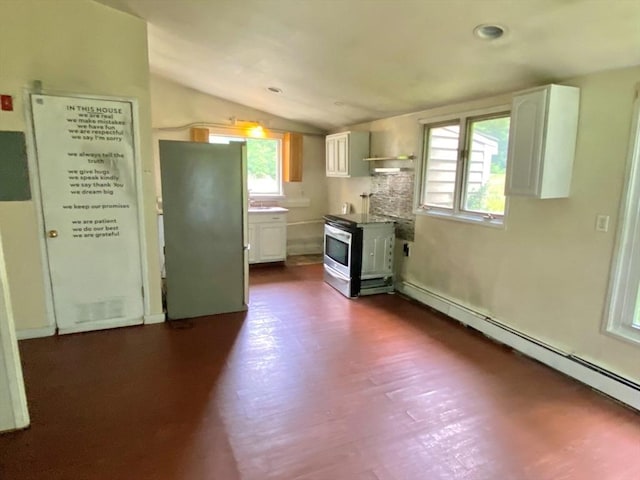 387 W Washington St, Hanson, MA 02341 - kitchen with range, a wood stove, freestanding refrigerator, vaulted ceiling, and white cabinets