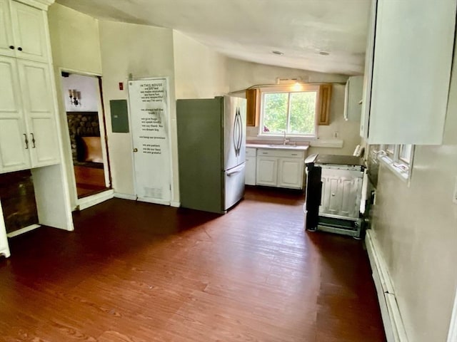 387 W Washington St, Hanson, MA 02341 - kitchen with freestanding refrigerator, vaulted ceiling, dark wood-style floors, range, and white cabinetry