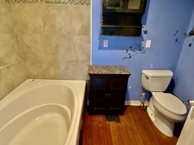 387 W Washington St, Hanson, MA 02341 - bathroom with a tub to relax in and wood finished floors