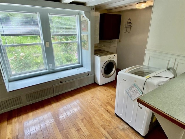 387 W Washington St, Hanson, MA 02341 - laundry area featuring washer / dryer, light wood-style flooring, and plenty of natural light
