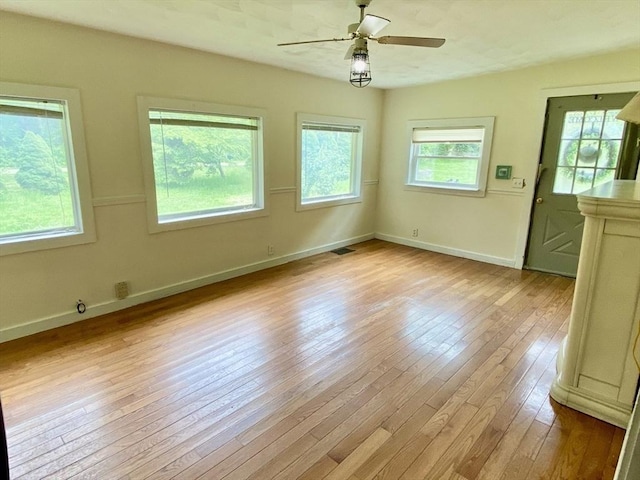 387 W Washington St, Hanson, MA 02341 - empty room featuring hardwood / wood-style flooring and ceiling fan