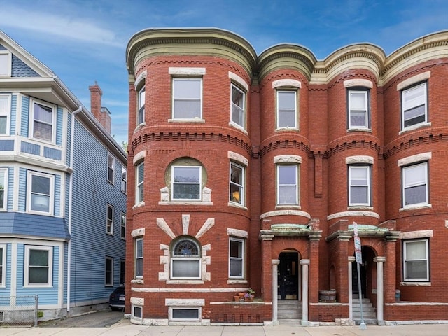 view of front of property featuring brick siding