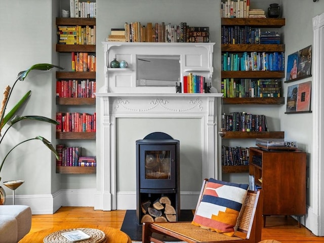 living area featuring wood finished floors and baseboards