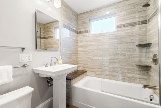 bathroom with toilet and shower / washtub combination
