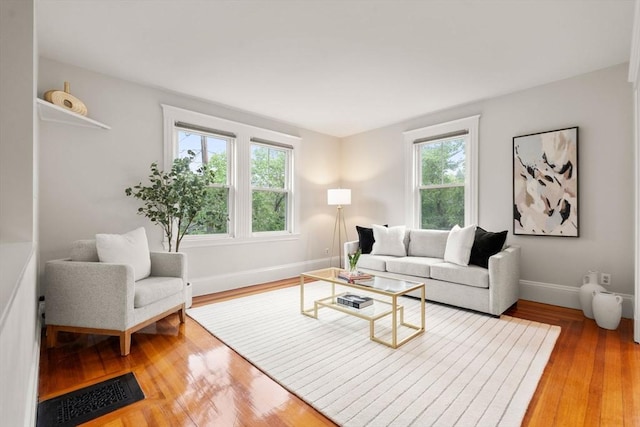 living room featuring light wood-style floors and baseboards