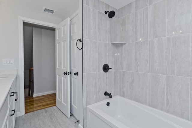 full bathroom featuring vanity and shower / tub combination
