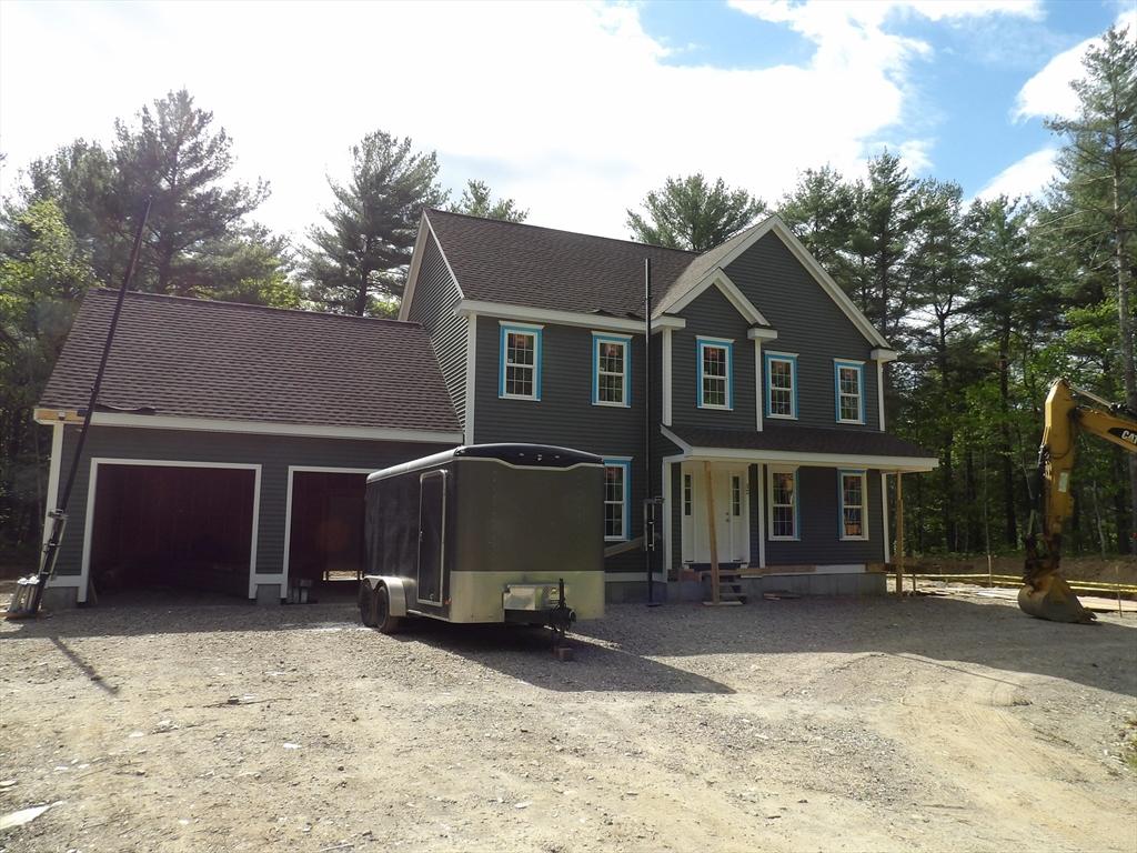 32 Forest, Berkley, MA 02779 - view of front of house with driveway, covered porch, an attached garage, and a shingled roof