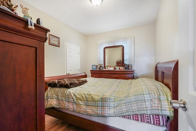 bedroom featuring wood finished floors