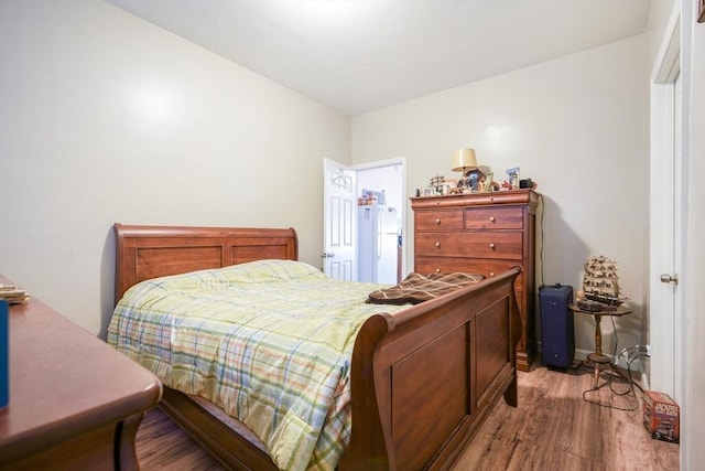 bedroom with wood finished floors