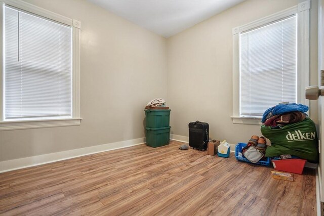 interior space with light wood finished floors and baseboards