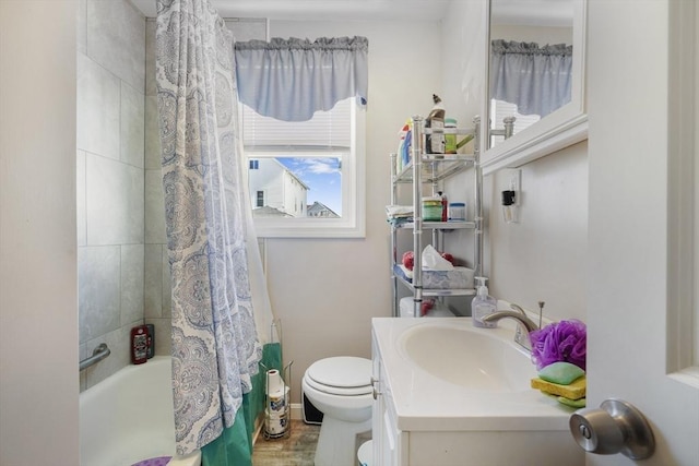 full bath featuring shower / bath combination with curtain, toilet, vanity, wood finished floors, and baseboards