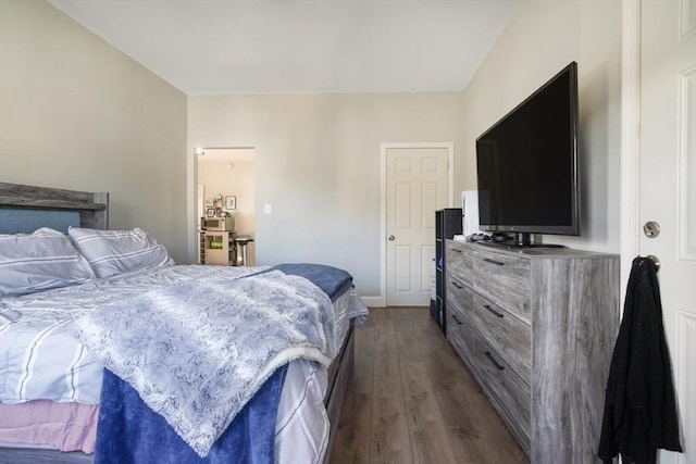 bedroom featuring dark wood finished floors