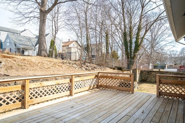 wooden deck featuring a residential view and fence