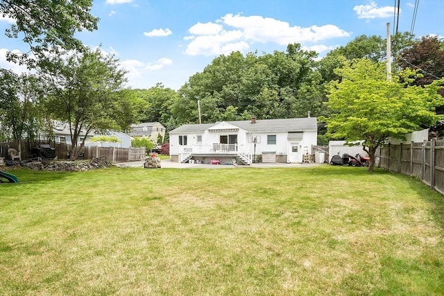 381 Water, Wakefield, MA 01880 - rear view of house with a wooden deck, a fenced backyard, and a patio