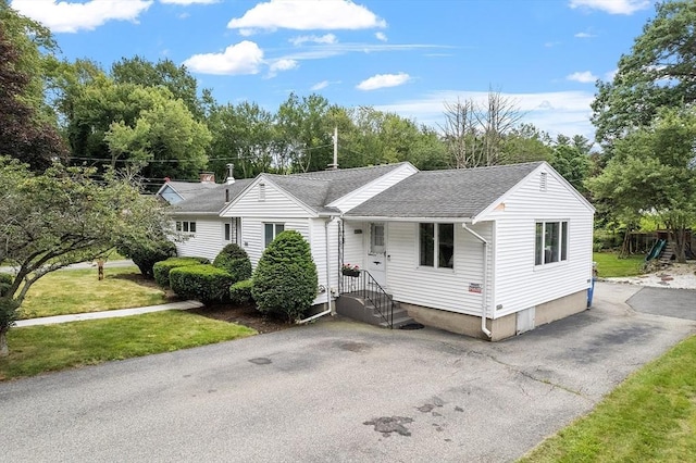 381 Water, Wakefield, MA 01880 - view of front of property with roof with shingles and view of wooded area