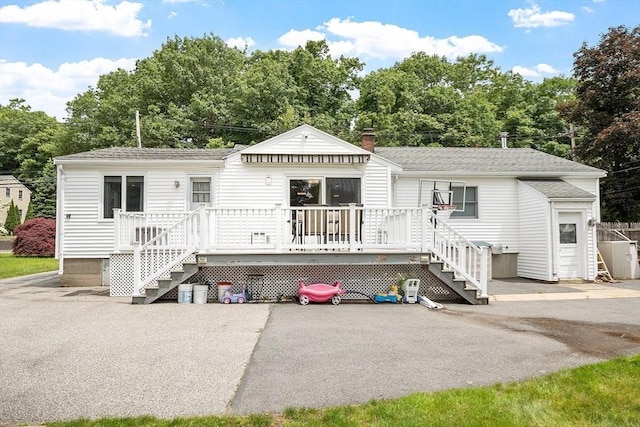 381 Water, Wakefield, MA 01880 - view of front of home featuring stairway, a deck, roof with shingles, and a chimney