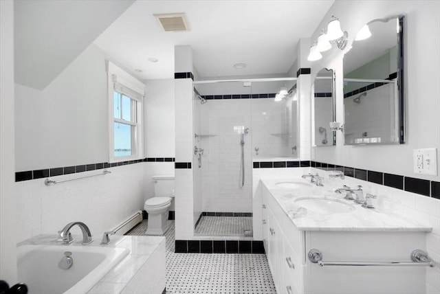 11 Paige St, Hingham, MA 02043 - bathroom featuring tile walls, a shower stall, a garden tub, toilet, and double vanity