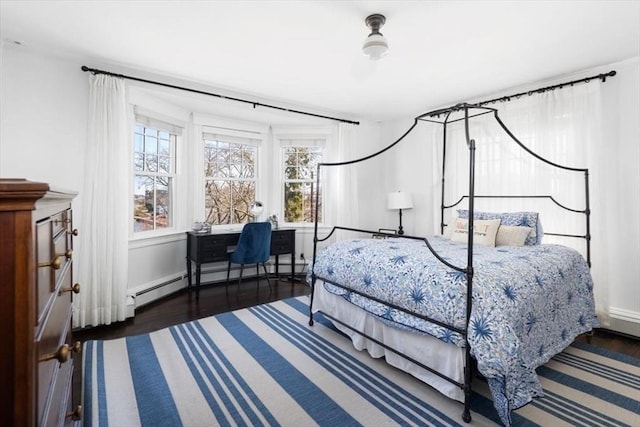 11 Paige St, Hingham, MA 02043 - bedroom with a baseboard radiator, wood finished floors, and a desk
