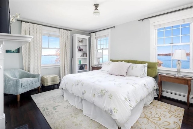 11 Paige St, Hingham, MA 02043 - bedroom featuring wood finished floors, baseboard heating, and a water view