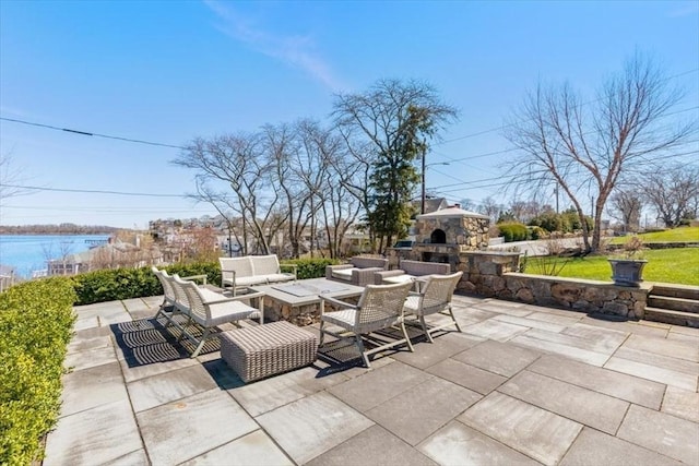 11 Paige St, Hingham, MA 02043 - view of patio featuring an outdoor living space with a fireplace and a water view