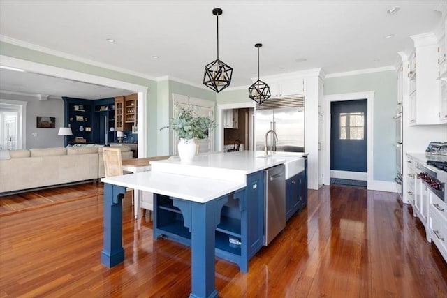 11 Paige St, Hingham, MA 02043 - kitchen with blue cabinets, white cabinetry, a sink, open shelves, and crown molding