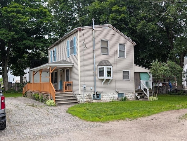 8 May St, Webster, MA 01570 - view of front of home featuring covered porch, a front yard, and view of scattered trees