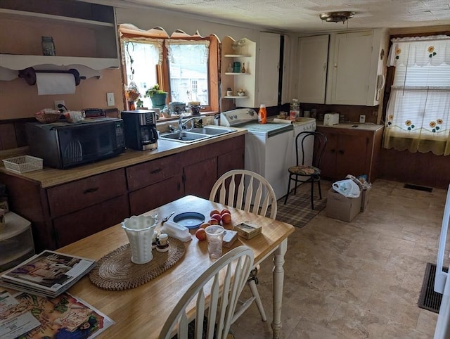 8 May St, Webster, MA 01570 - kitchen with open shelves, black microwave, light countertops, and white cabinets