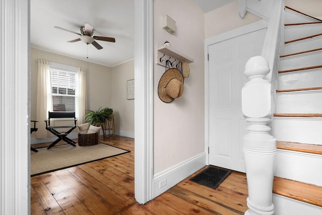 56 Bridge St Unit 56, Beverly, MA 01915 - foyer featuring hardwood / wood-style floors, a ceiling fan, stairs, and crown molding