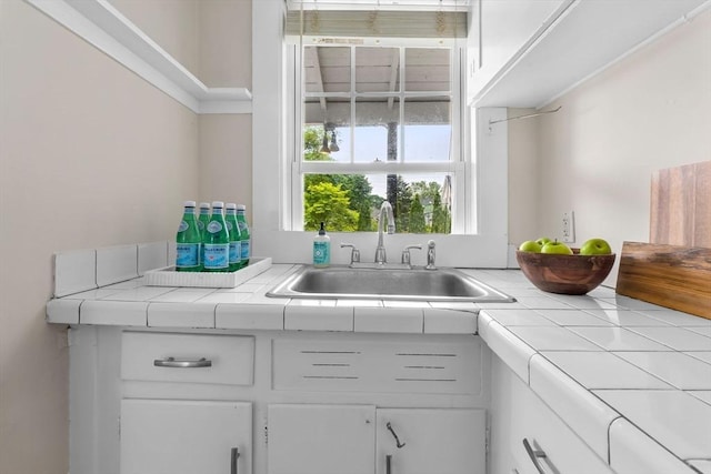 56 Bridge St Unit 56, Beverly, MA 01915 - kitchen with tile countertops and white cabinetry