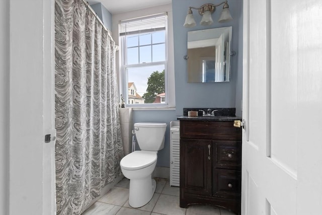 56 Bridge St Unit 56, Beverly, MA 01915 - bathroom with vanity, tile patterned floors, and curtained shower